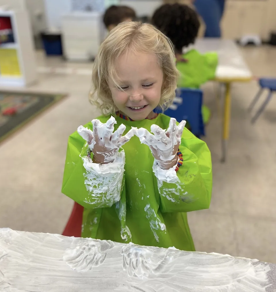 Preschool child exploring paint at Inspire